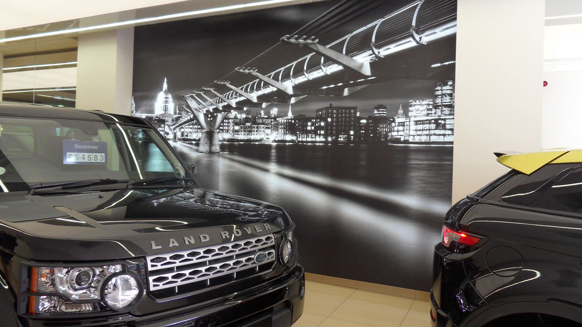 Land Rover car showroom cityscape illuminated graphic wall