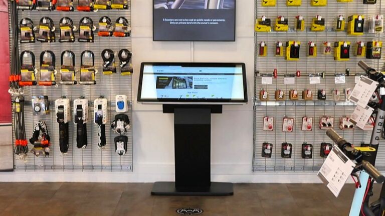 Angled freestanding touch-screen kiosk table in electrical wholesaler