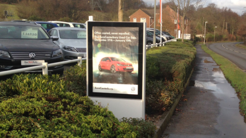 Back-to-Back Onyx poster case outside VW car showroom