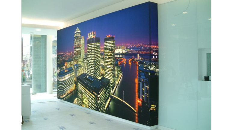 Custom lightbox with Cityscape graphic fitted around corner illuminating out front and sides