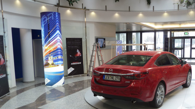 Illuminated Fabric Column Display in Car Showroom