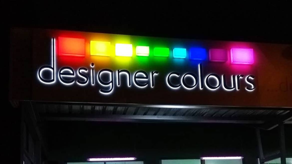 Illuminated shop signage for designer colours at nighttime