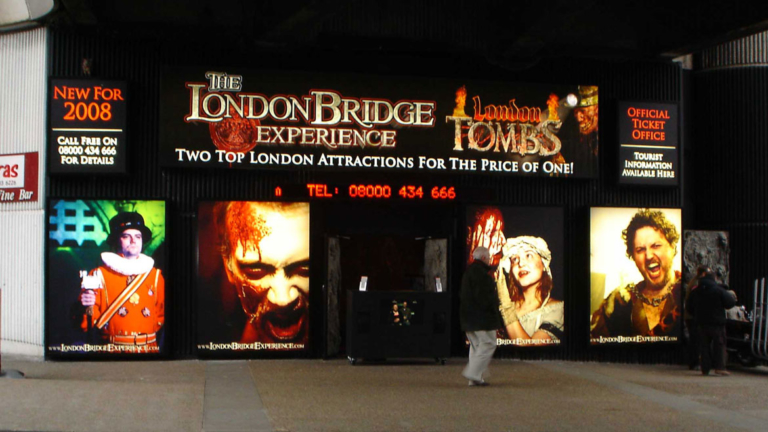 Illuminated signs for London Bridge experience and London Tombs