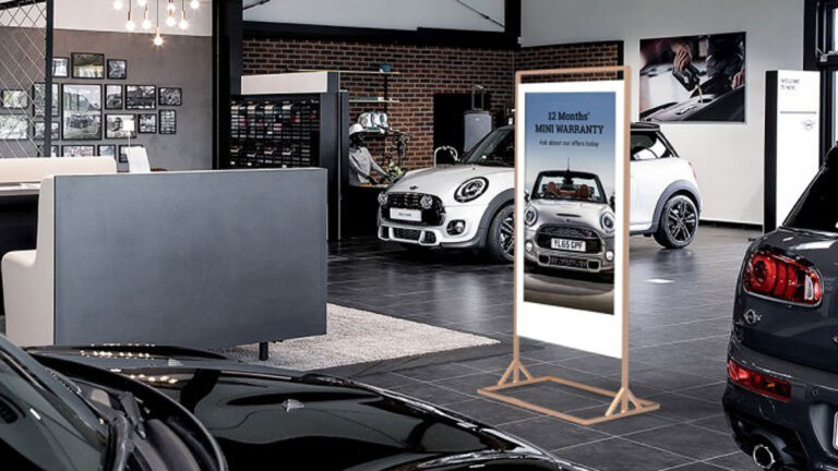 Slimline Freestanding Double Sided Digital Display in a Car Showroom
