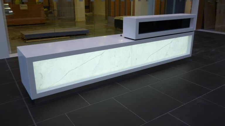 LED Light Panels illuminating a marble reception desk
