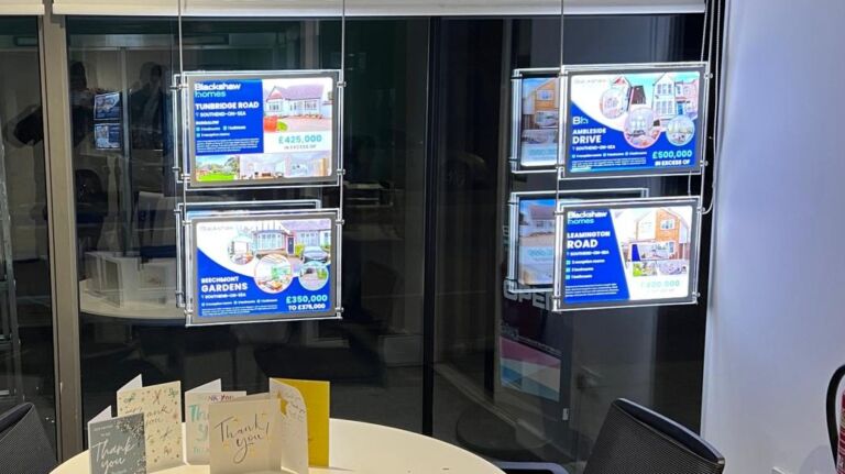 Estate Agent LED poster pockets inside Blackshaw Homes